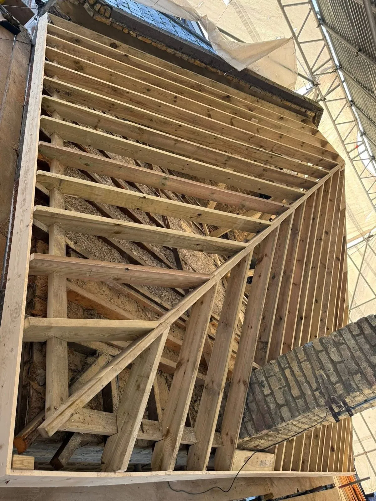 New roof timbers and rafters during a re-roof in Polperro