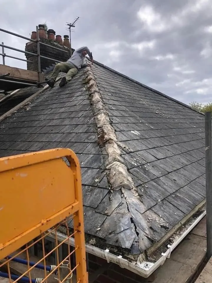 Slate roof ridge and chimney repair in Polperro